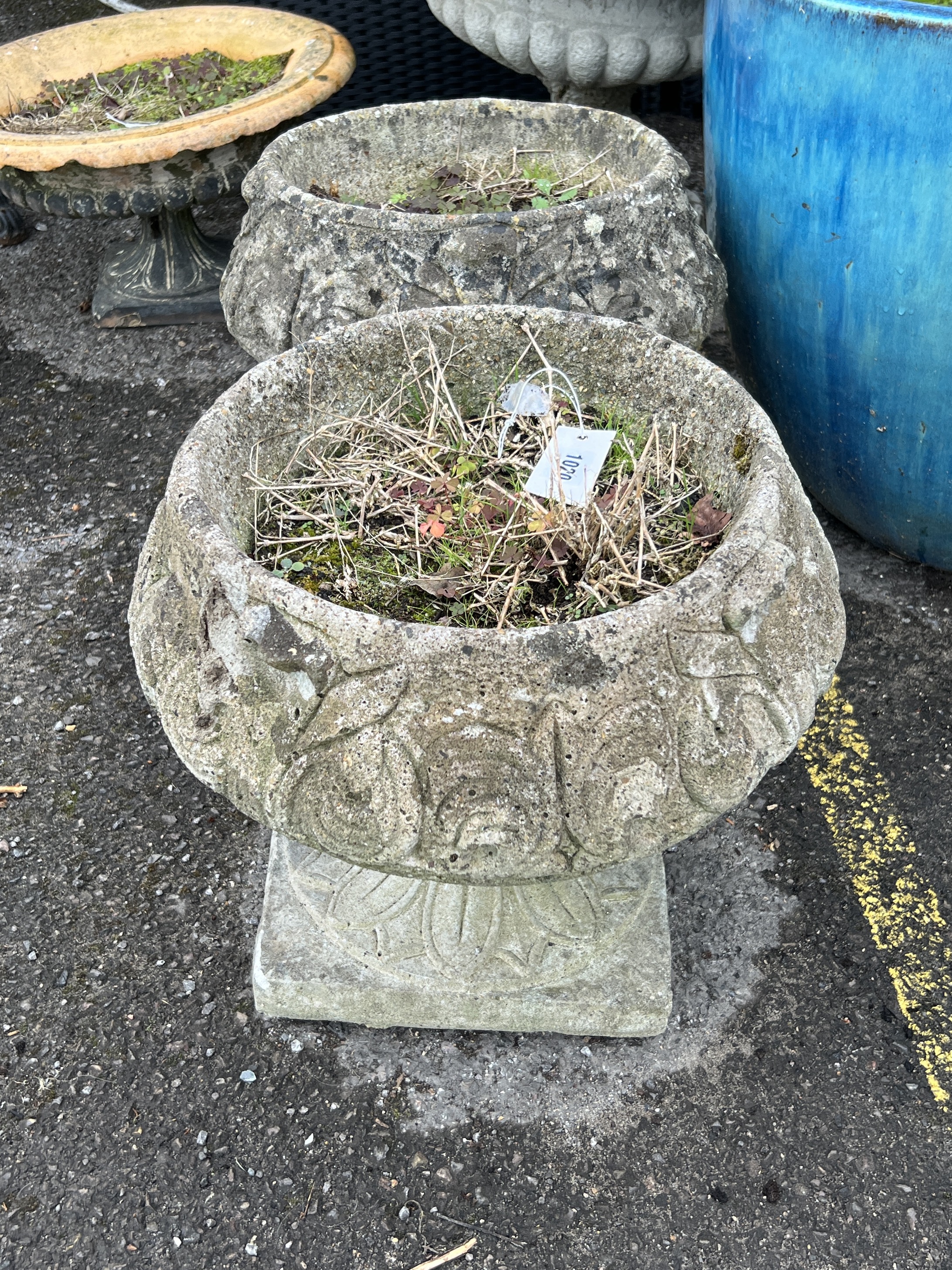 A pair of circular reconstituted stone garden planters, diameter 40cm, height 37cm